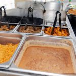 Catered event has traditional Mexican taco makings of rice, beans, pork al pastor, pollo, and carne asada tacos.